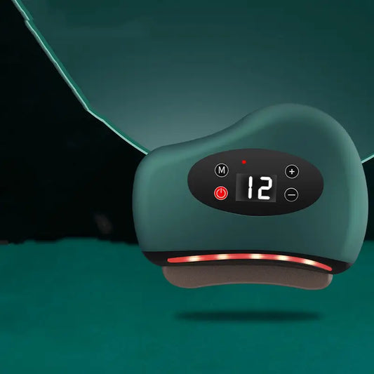 Green Gua Sha device with digital control panel on a dark background