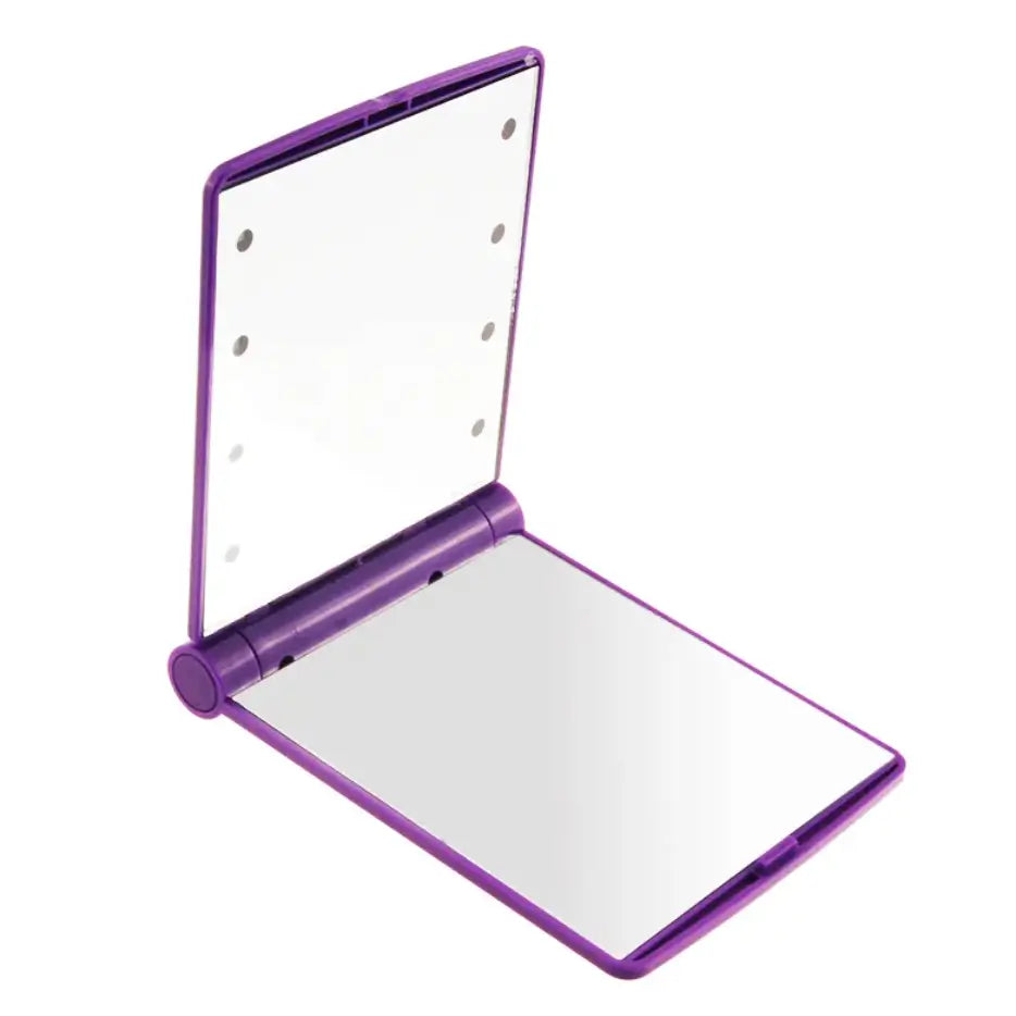 Purple compact mirror with a white interior on a white background