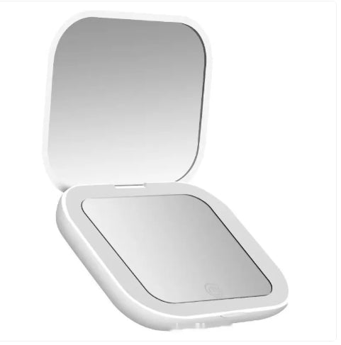 White handheld compact mirror with a reflective surface on a white background