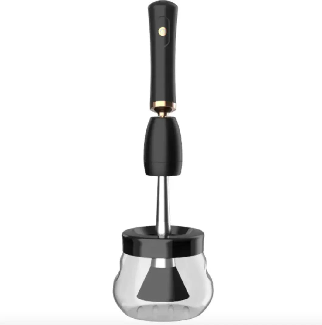 Black makeup brush cleaner on a clear glass container