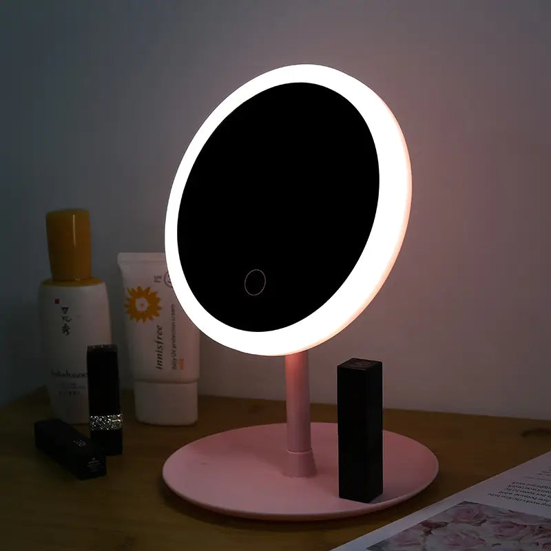 Lighted makeup mirror on a table with skincare products