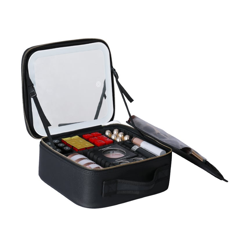 Black makeup case with open lid displaying various cosmetic items on a white background