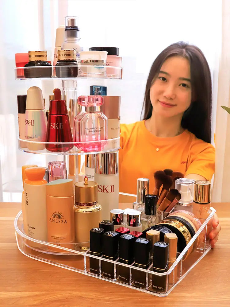Woman holding a transparent makeup organizer with various skincare and cosmetic products.