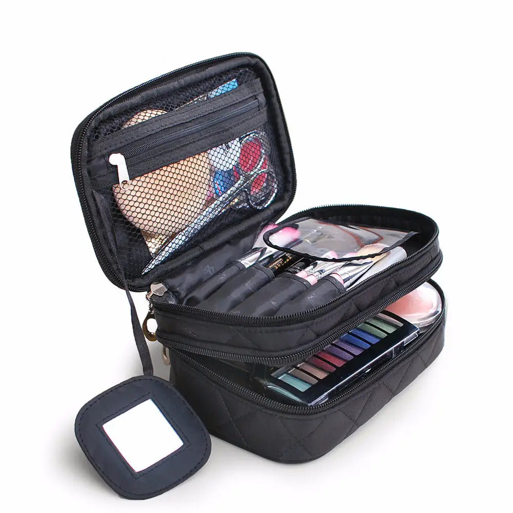 Black makeup travel case with various cosmetic items on a white background