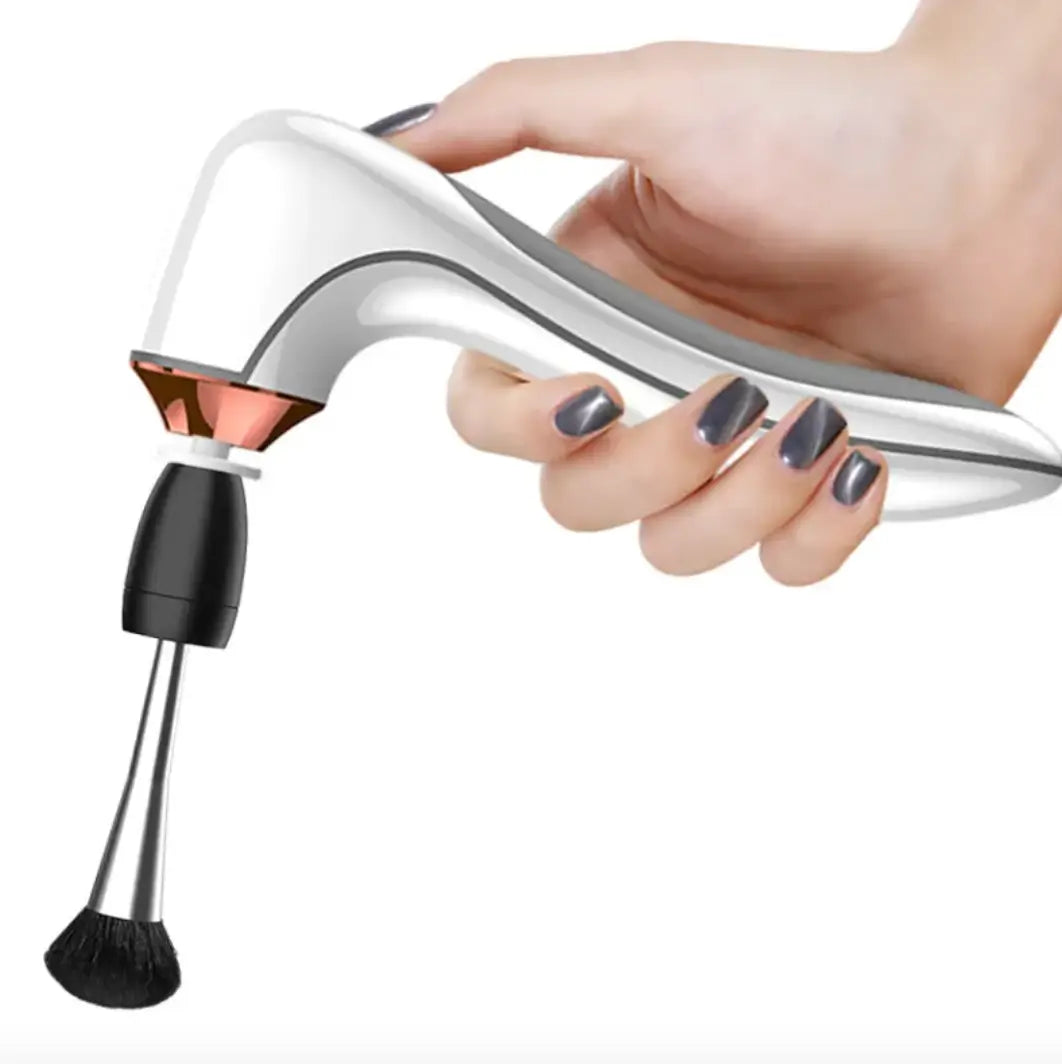 Hand holding a cosmetic brush cleaner with a white background