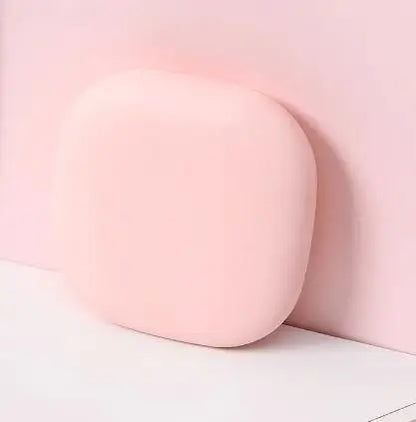 Close-up of a pink compact LED mirror with a blurred background