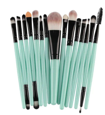Set of makeup brushes with green handles on a white background