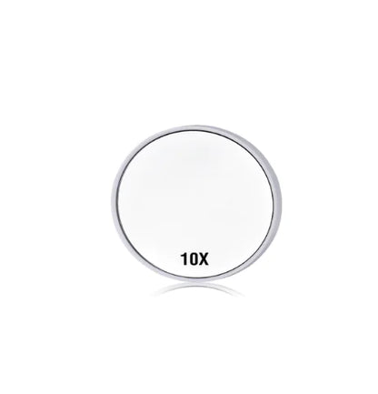 Circular magnifying glass with '10X' marking on a white background