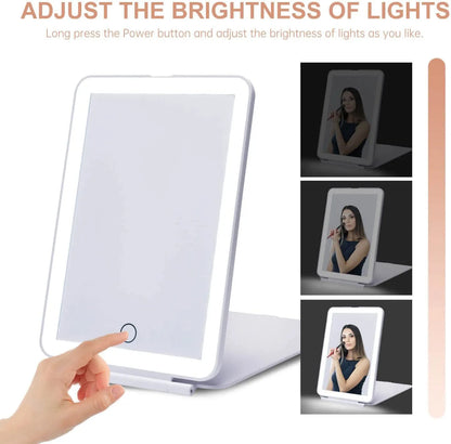 Light-up mirror with brightness adjustment feature, shown in use.