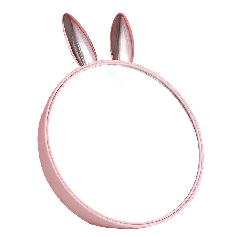 Pink hairband with bunny ears on a white background