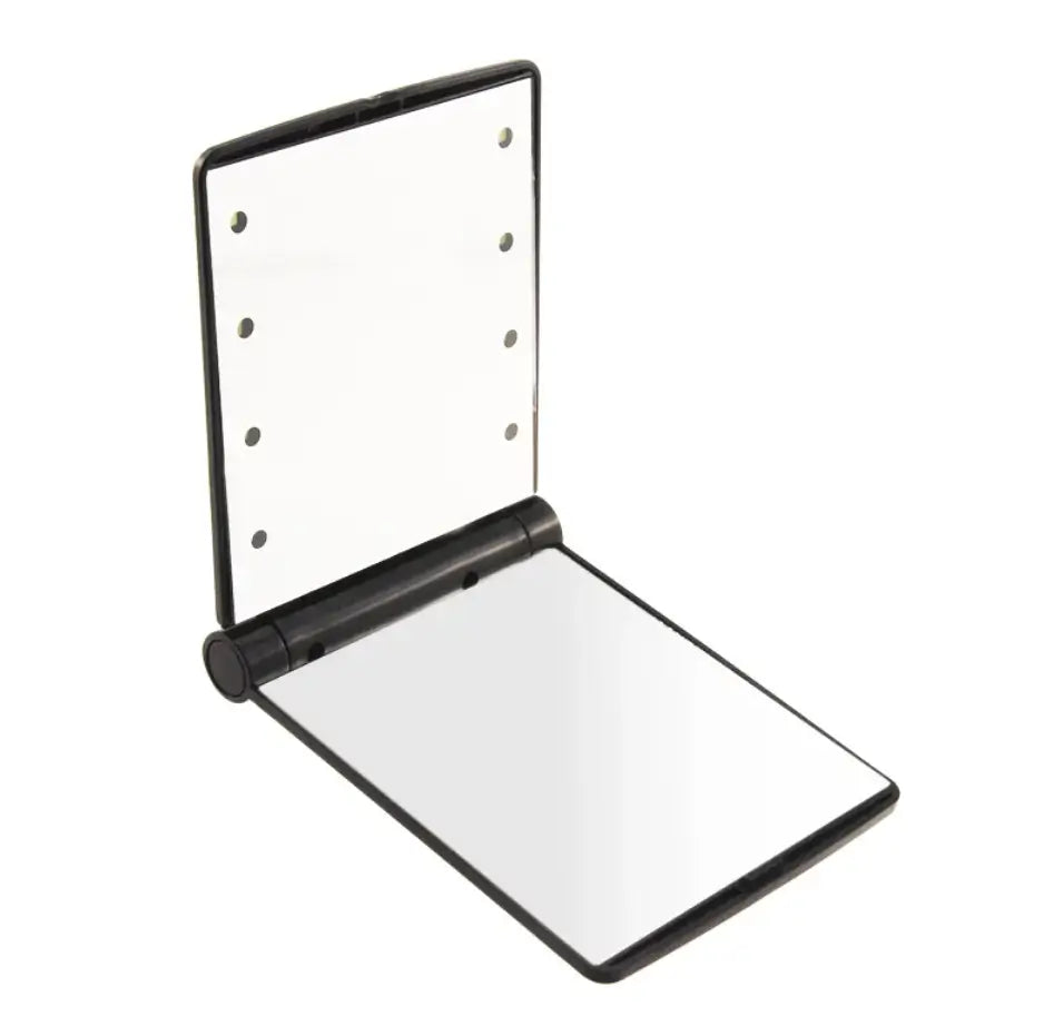 Compact mirror with black frame on a white background